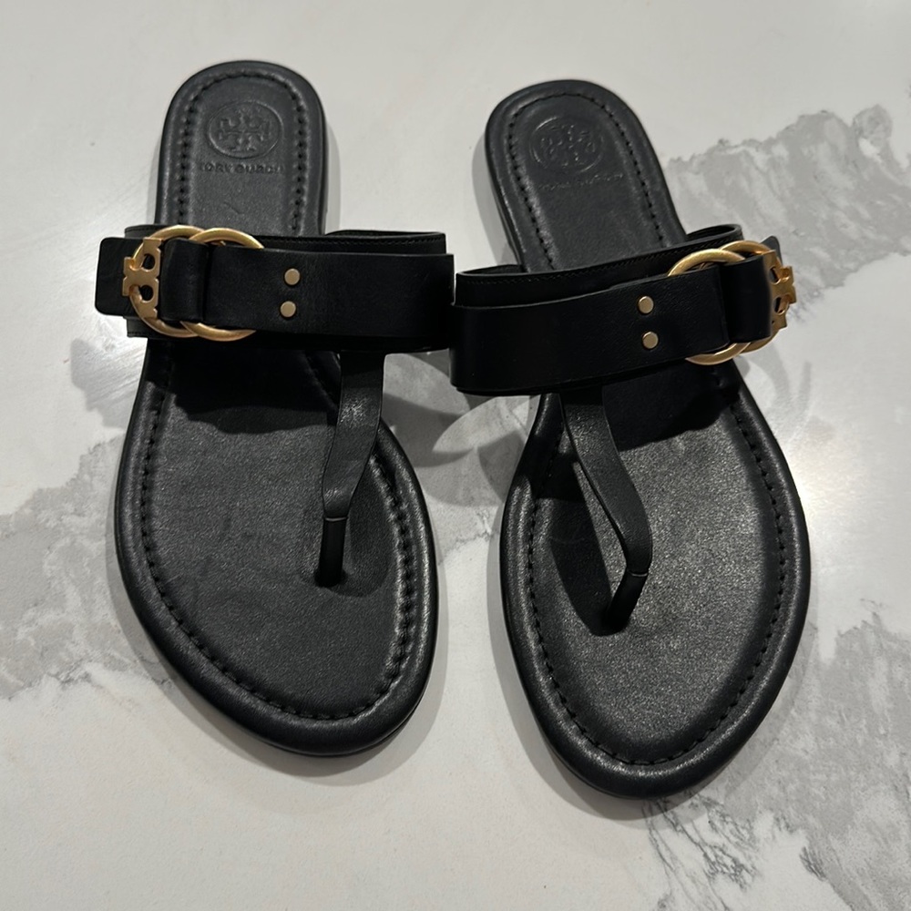 New (without box) Tory Burch Black Sandals with gold buckle, size 7.